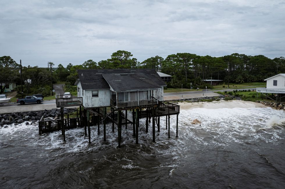 u200bA drone view shows a stilt house as Hurricane Helene intensifies