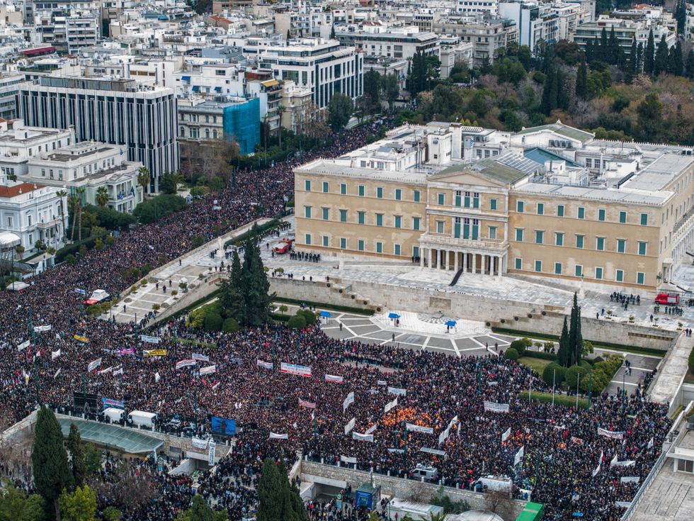 \u200bA drone view shows people gathering in front of the Greek parliament during a protest