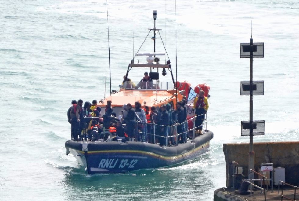 u200bA group of people thought to be migrants are brought in to Dover, Kent,