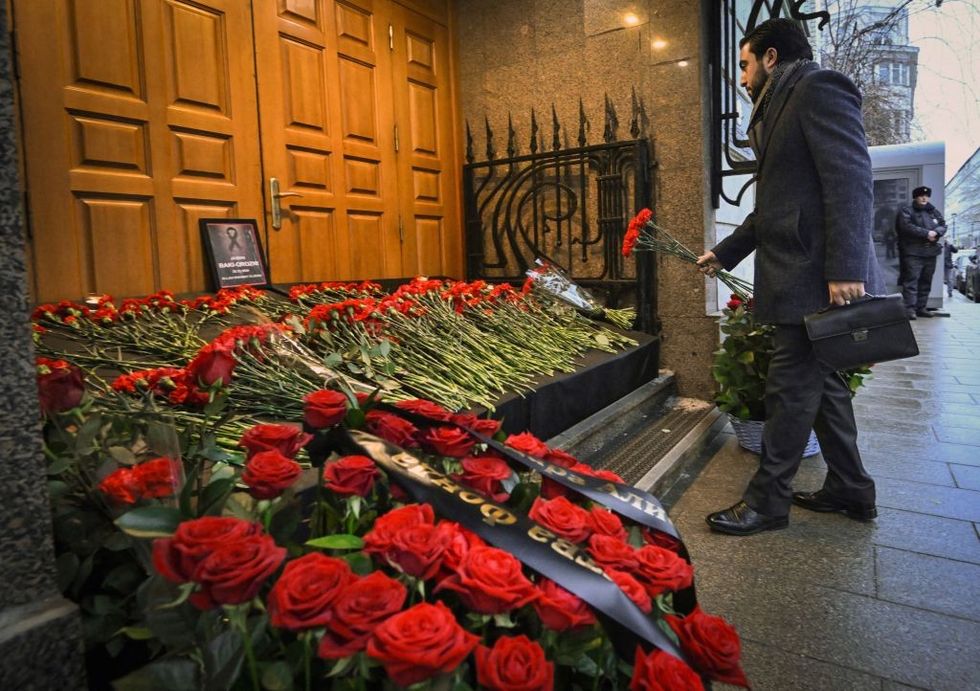 u200bA man lays flowers to Azerbaijan's Embassy in Moscow