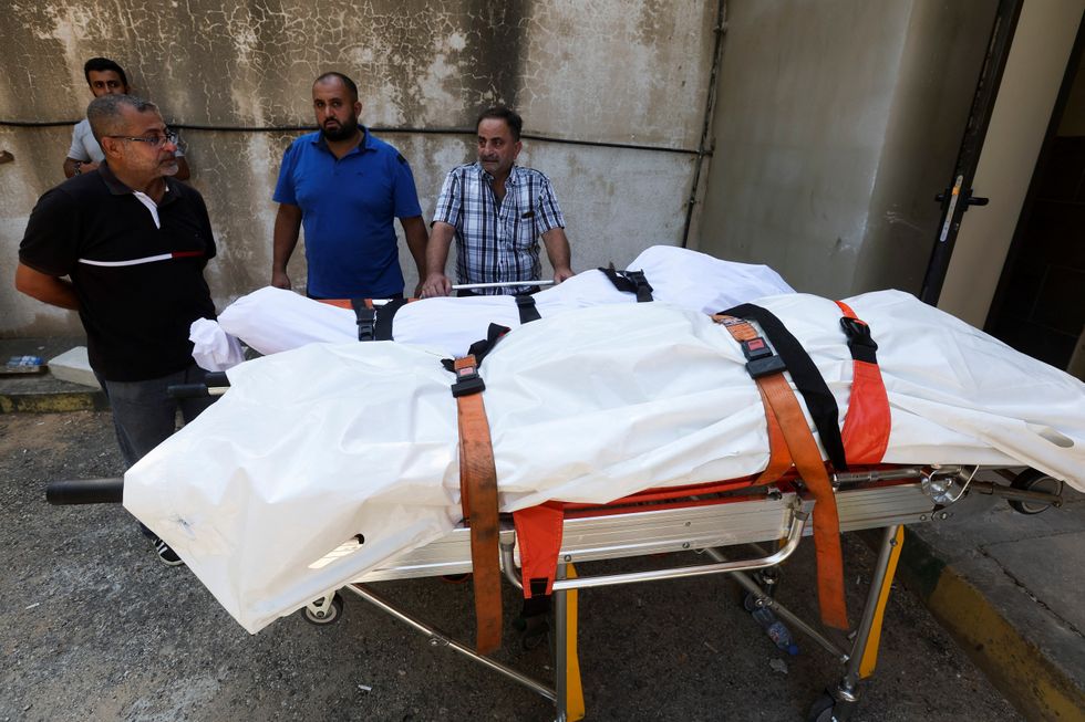 \u200bA man mourns people killed in an Israeli attack on Sunday in the city of Ain Deleb in southern Lebanon,