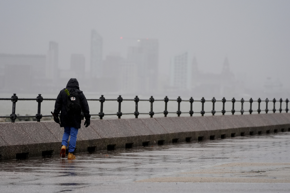 u200bA man walks along The Promenade New Brighton in Liverpool