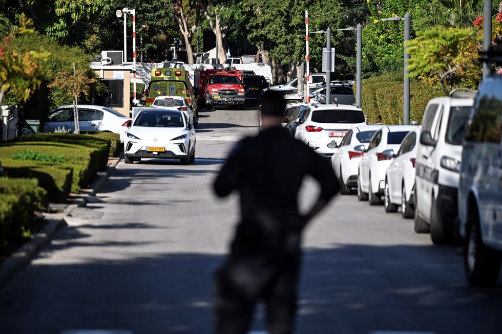 u200bA member of Israeli security personnel stands at the entrance to a street, following a drone attack from Lebanon towards Israel amid ongoing hostilities between Hezbollah and Israel, in Caesarea