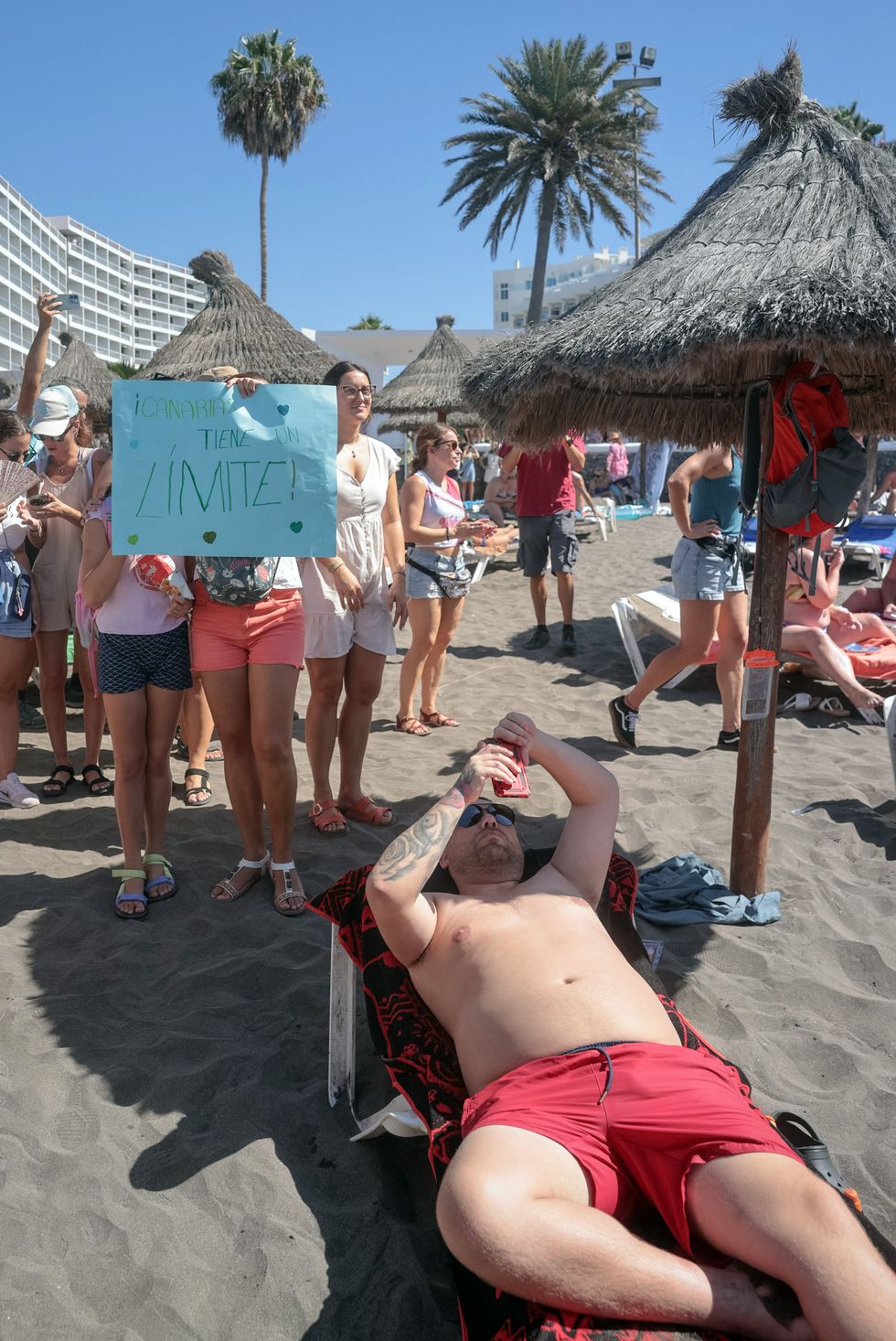 u200bA protester holds a sign reading 'The Canary Islands have a limit'