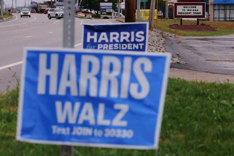 \u200bA sign supporting Harris stands in front of a sign welcoming Donald Trump for a campaign rally in Indiana, Pennsylvania