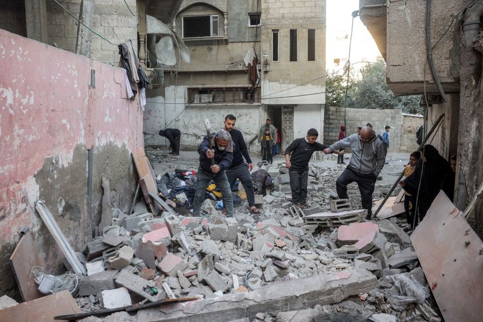 u200ba street outside an apartment building hit by Israeli bombardment in the Bureij camp for Palestinian refugees