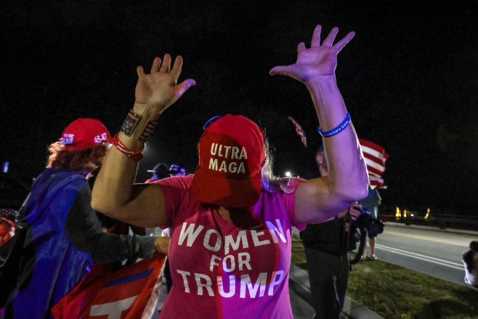 u200bA supporter of Donald Trump gestures as they gather near his Mar-a-Lago resort in Palm Beach