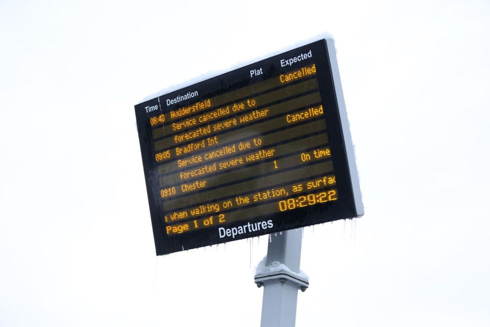 u200bA train departure screen shows cancelations due to severe weather on November 19, 2024 in Bradford