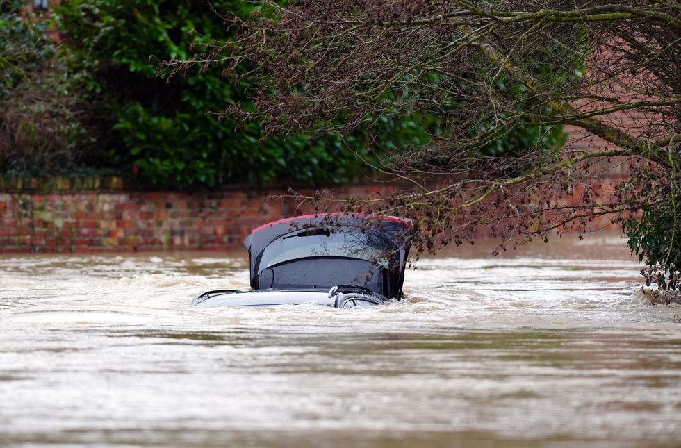 u200bA vehicle is submerged under water near the River Devon