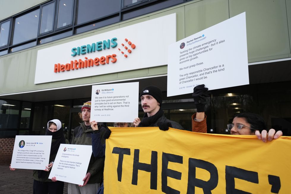 \u200bActivists from Fossil Free London and Green New Deal Rising take part in a protest against a third runway at Heathrow, and expansion at Gatwick