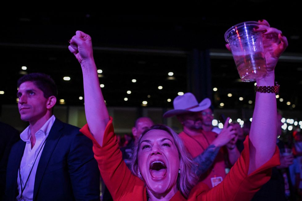 u200bAn attendee reacts to early election results at Republican presidential nominee Trump