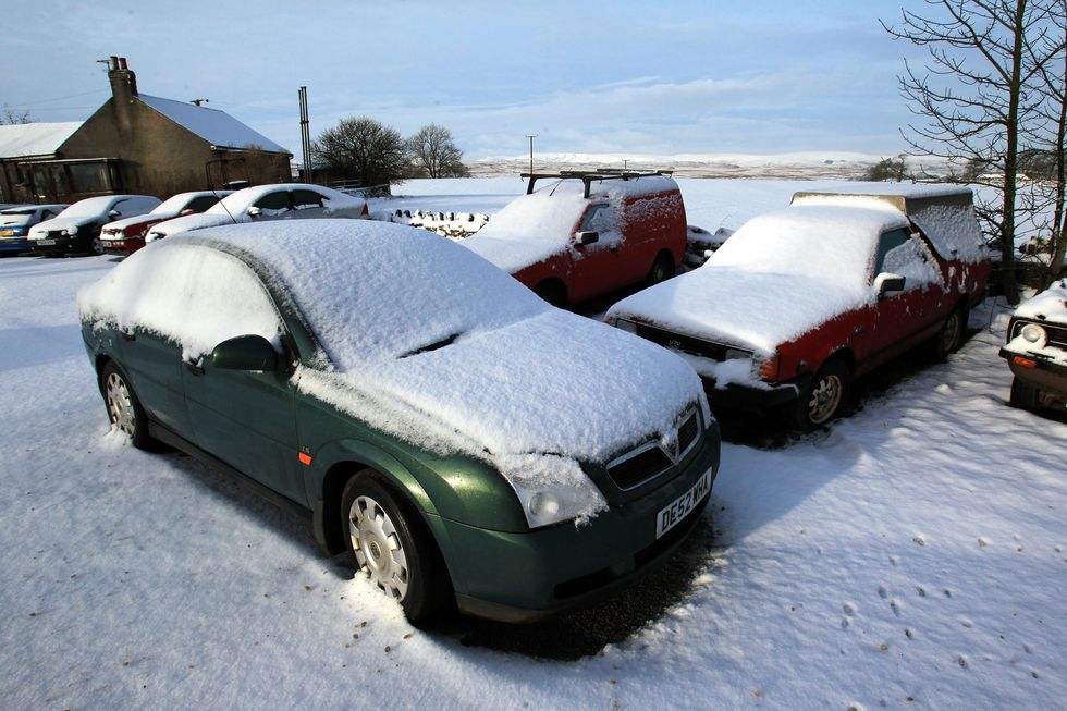 u200bCars are seen covered in snow in Shap, Cumbria,