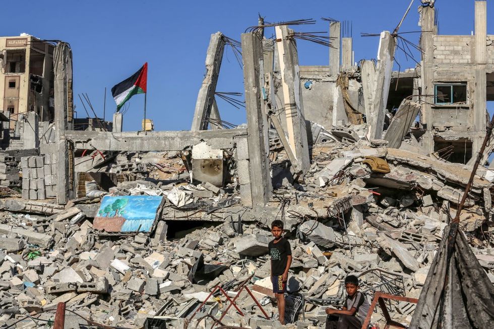 u200bChildren are seen among the rubble as Palestinians try to survive amid the rubble of houses destroyed in the Israeli attacks