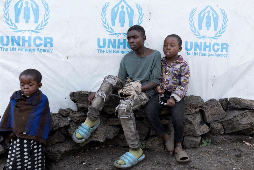 u200bChristevie Lukeka,10, sits with Gedeon Kakule,13, both who recovered from Mpox