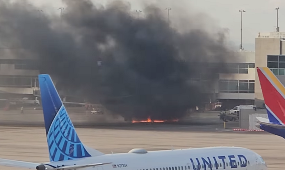 \u200bClouds of smoke engulfed the passengers, as they make their way away from the aircraft