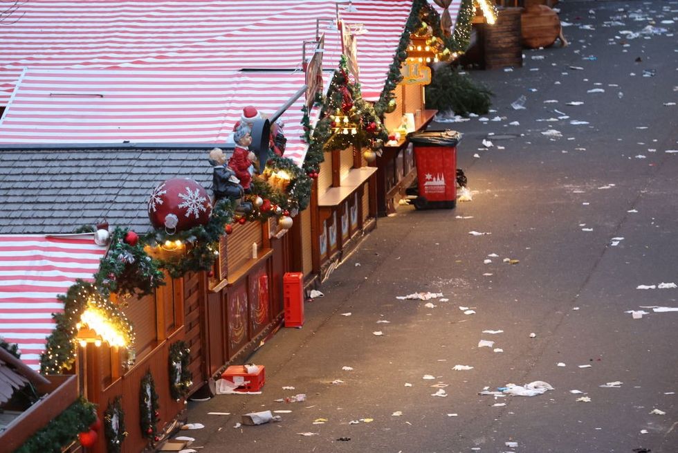 \u200bDebris and closed stalls are seen on a Christmas market one day after a car-ramming attack in Magdeburg,