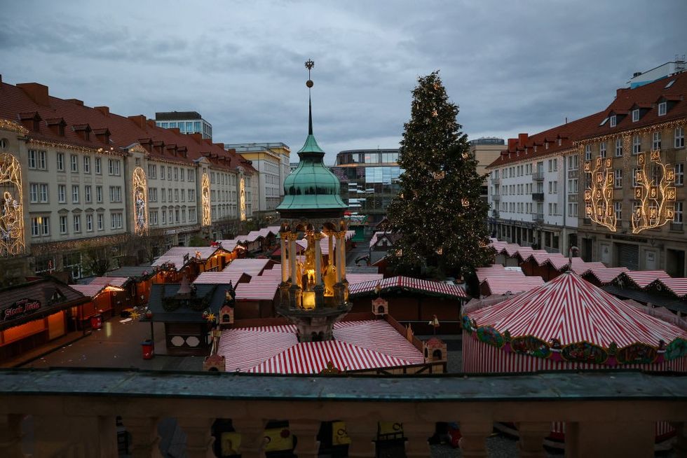 \u200bDebris and closed stalls are seen on the site of a car-ramming attack on a Christmas market in Magdeburg