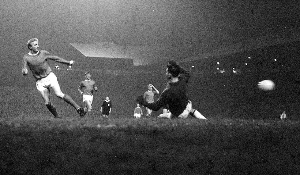 \u200bDenis Law (left) scores the third goal for Manchester United in their 6-1 win over the Dutch team Willem II