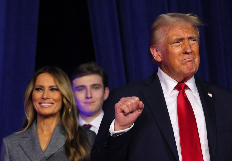 \u200bDonald Trump takes the stage with his wife Melania and son Barron to address supporters at his rally