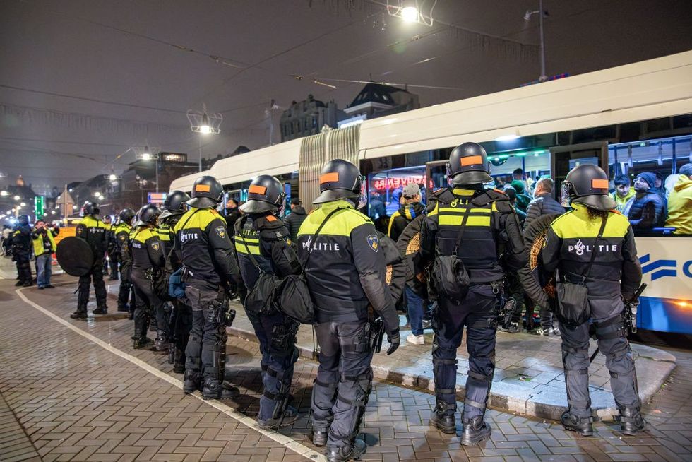 u200bDutch mobile Police officers stand guard after several scuffles broke out in the city center following the UEFA Europa League match