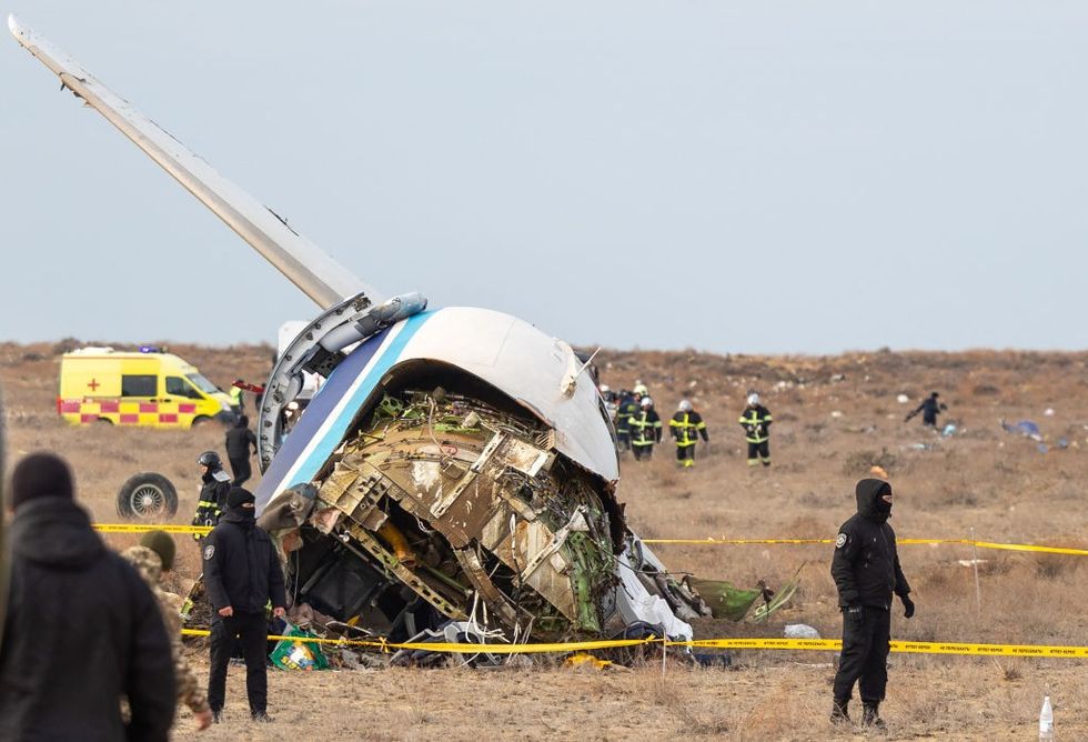 u200bEmergency specialists work at the crash site of an Azerbaijan Airlines passenger jet