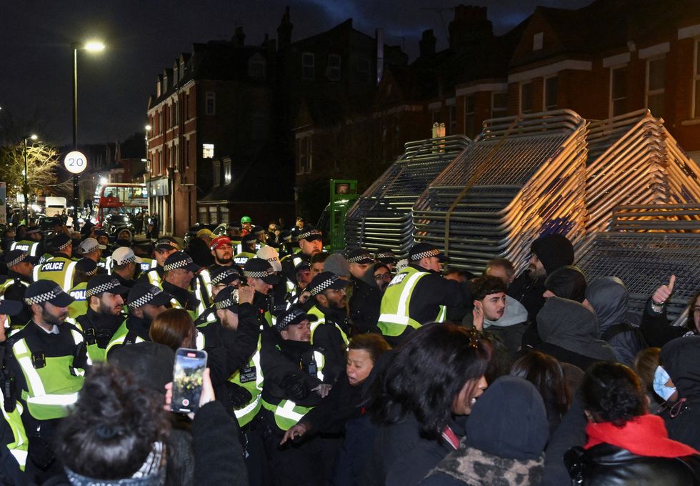 u200bemonstrators clash with police officers near a Kurdish community centre