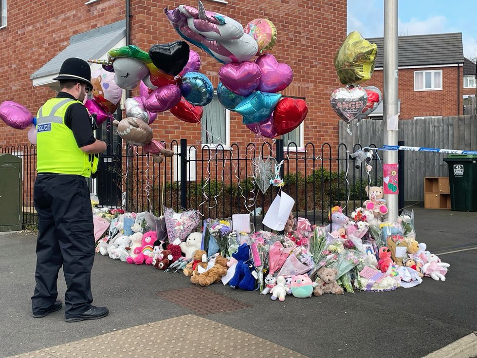 u200bFloral tributes left at the entrance to Robin Close