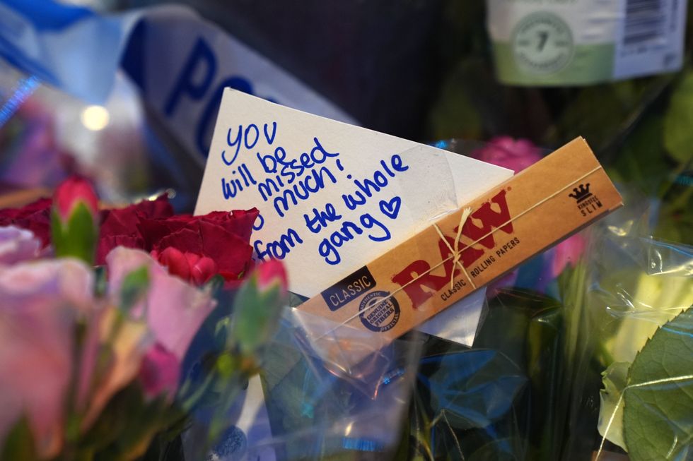 u200bFloral tributes near Greenhill Street, close to Bedford bus station, following the stabbing of Thomas Taylor