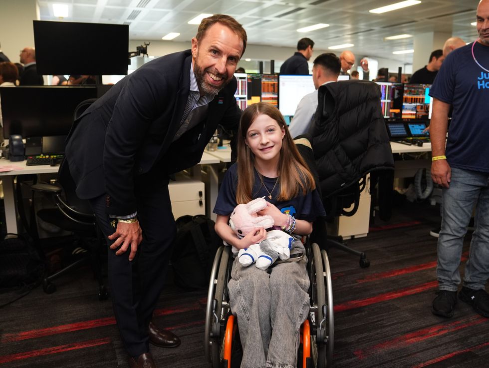 \u200bGareth Southgate with 11-year-old Sophie Joscelyne during the BGC annual charity day