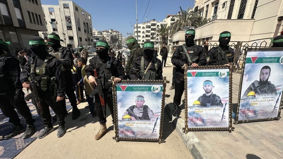 \u200bHamas members and locals attend the funeral ceremony organised for Al-Qassam Brigades members killed in Israel's attack