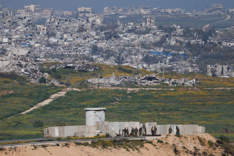 \u200bIsraeli soldiers operate at a post on the Israeli side of the border between Israel and Gaza