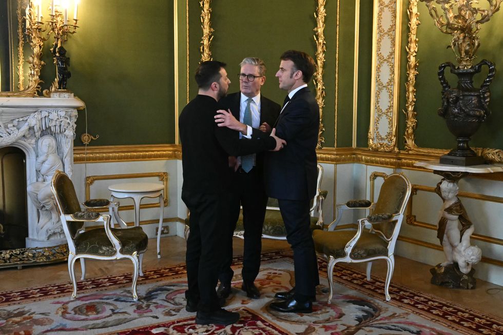 \u200bKeir Starmer embraces Volodymyr Zelensky and Emmanuel Macron