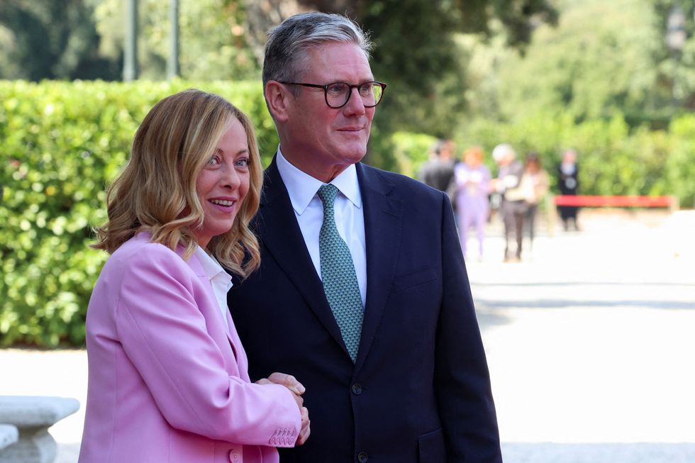 \u200bKeir Starmer shakes hands with Italian Prime Minister Giorgia Meloni