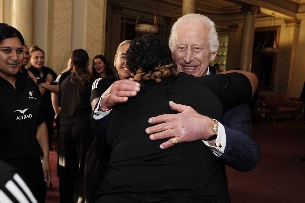 u200bKing Charles hugging New Zealand's women rugby players