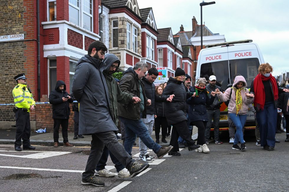 u200bMembers of the Kurdish community perform a dance near a Kurdish community centre as a protest earlier today