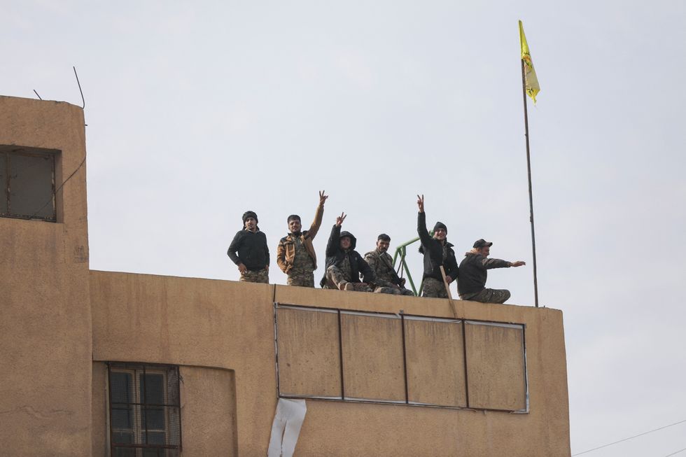 u200bMembers of the Kurdish-led Syrian Democratic Forces (SDF) gesture in Deir al-Zor, after U.S.-backed alliance led by Syrian Kurdish fighters captured Deir el-Zor