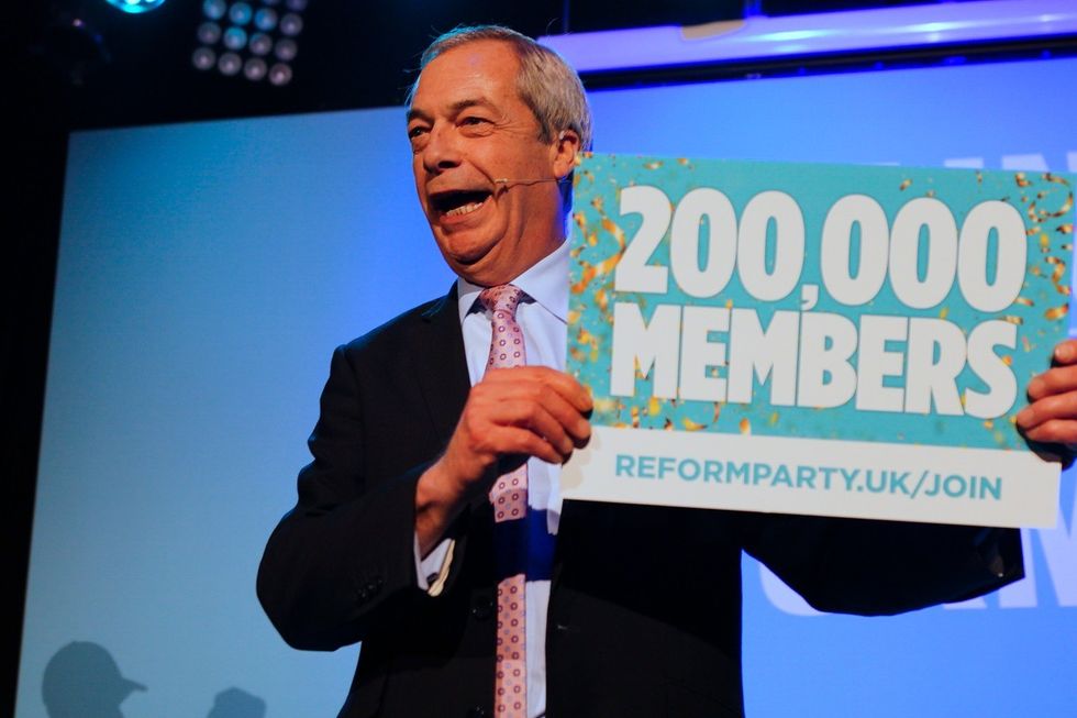 u200bNigel Farage appeared on stage with a placard celebrating the major milestone