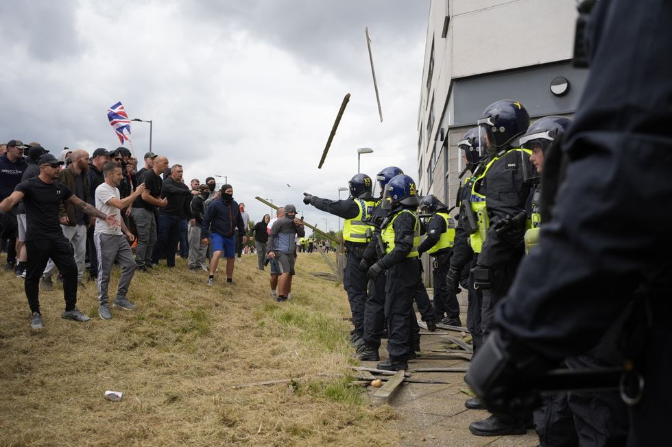 u200bObjects thrown at the hotel as trouble flares during an anti-immigration riot outside the Holiday Inn Express in Rotherham