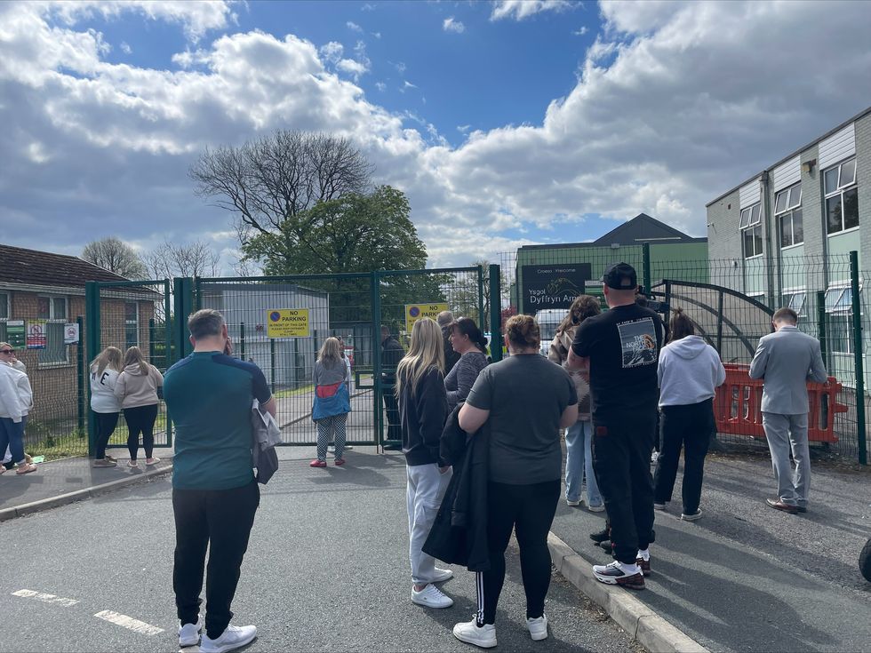 u200bParents wait at the gates of Amman Valley school, in Ammanford, Carmarthenshire