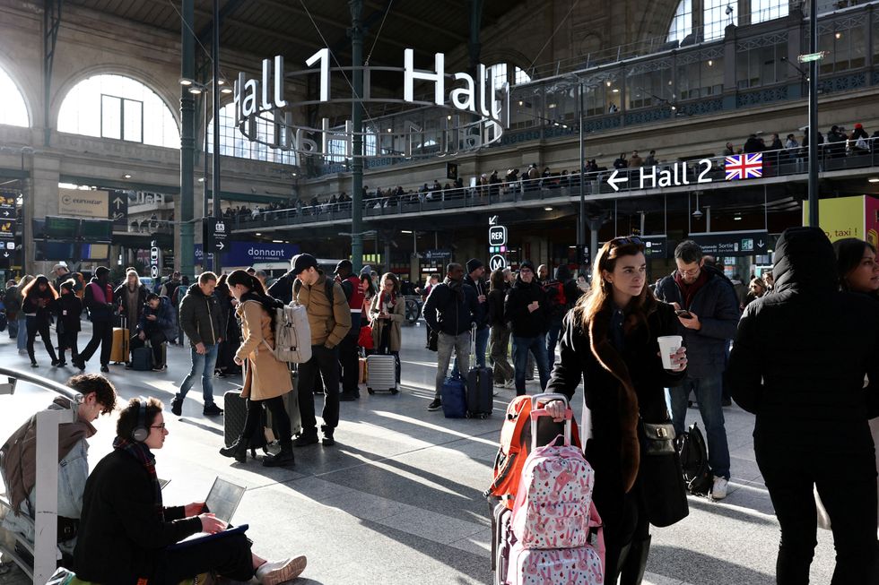 u200bPassengers wait inside the departure hall as traffic has been disrupted at the Gare du Nord train station