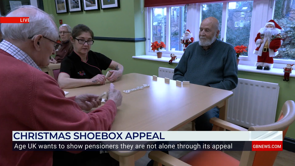 u200bPensioners playing dominoes at a care home