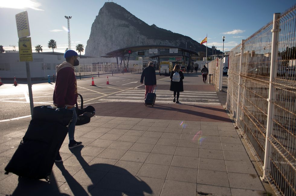 u200bPeople cross the border between Spain and Gibraltar at La Linea de la Concepcion