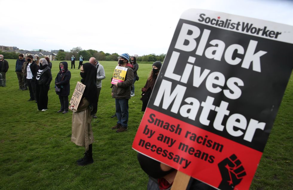 u200bPeople during a Black Lives Matter rally in Holyrood Park, Edinburgh, to commemorate George Floyd's death