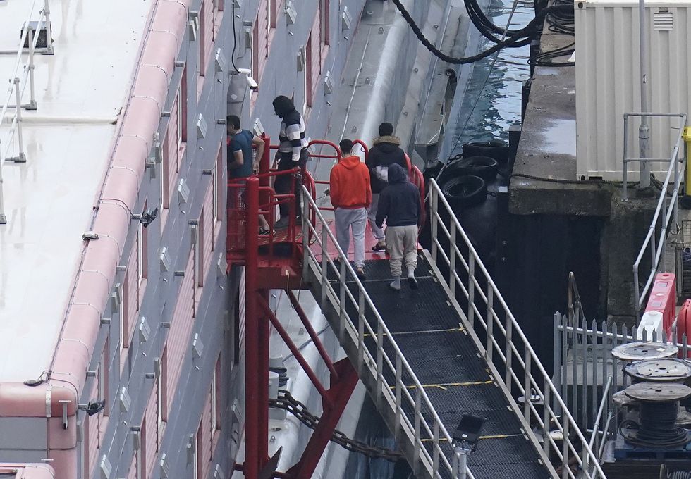 \u200bPeople entering the Bibby Stockholm barge