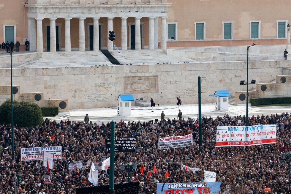 \u200bPeople gather in front of the Greek parliament during a protest