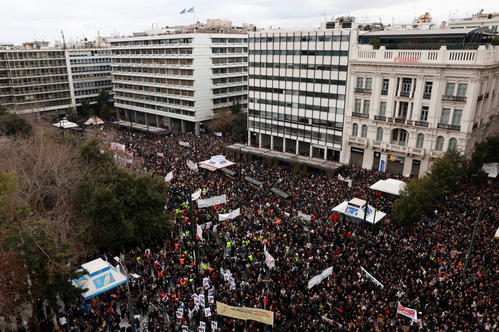 \u200bPeople gather near the Greek parliament during a protest in Athens