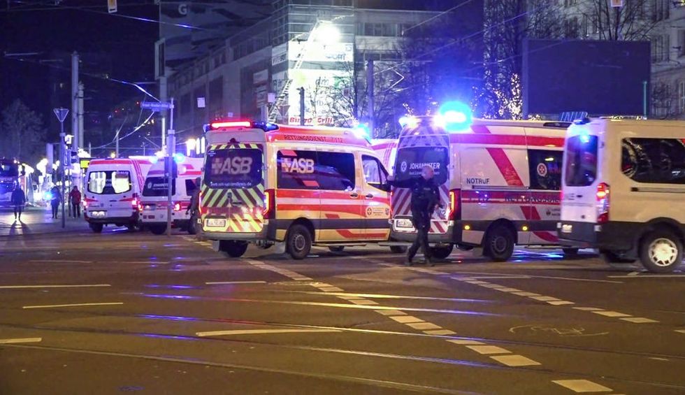 u200bPolice and ambulances stand next to the Christmas market