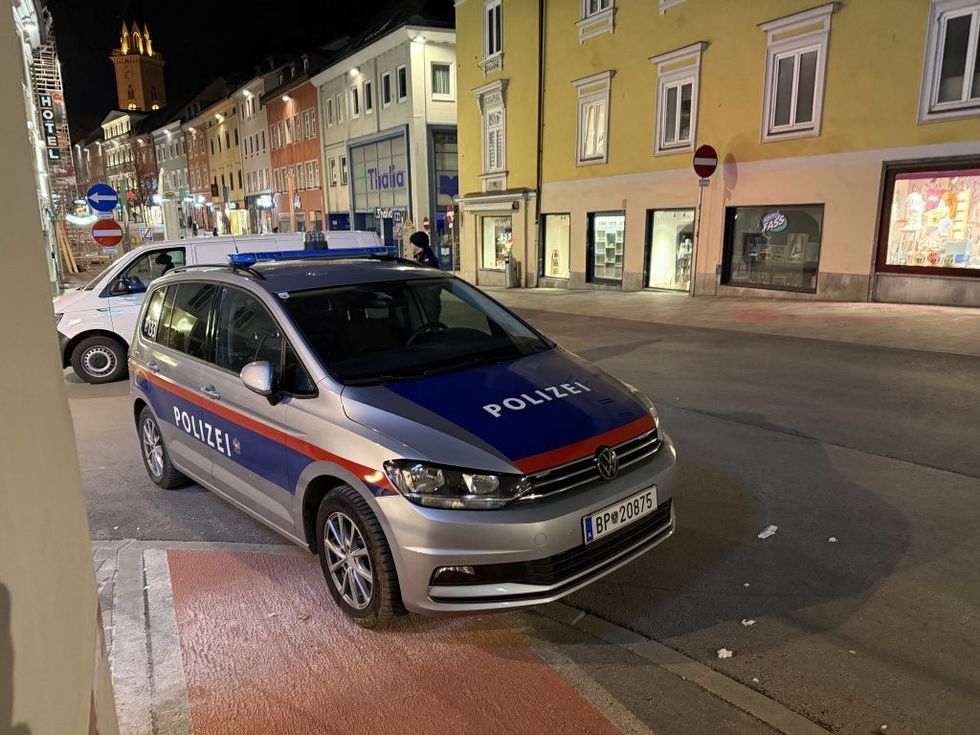 u200bPolice are seen after a knife attack near the main square in the city centre of Villach, southern Austria