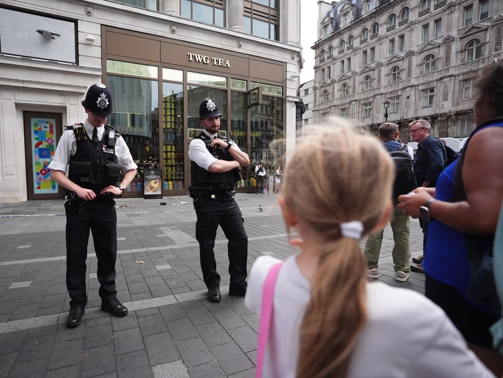 u200bPolice officers at the scene of double stabbing in Leicester Square