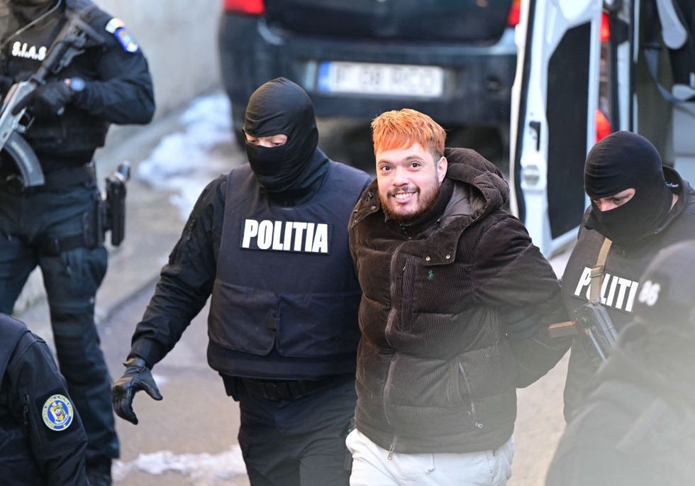 \u200bPolicemen escort French convict Mohamed Amra to the court of appeal in Bucharest, Romania